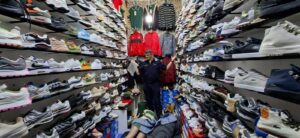 An official stands inside a shop in Johannesburg CBD during a joint operation in which police seized counterfeit goods worth more than R160 million. Photograph: SAPS.