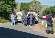 Police officers detain protesters near SAPS vehicles outside the 1820 Settlers National Monument in Makhanda on Friday, 2 October 2026, during demonstrations linked to Rhodes University's proposed 2027 student fee-payment protocol. Photograph: Supplied