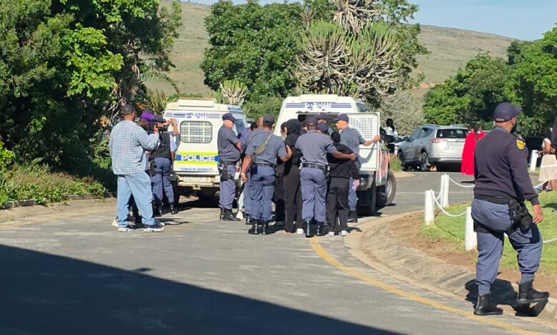 Police officers detain protesters near SAPS vehicles outside the 1820 Settlers National Monument in Makhanda on Friday, 2 October 2026, during demonstrations linked to Rhodes University's proposed 2027 student fee-payment protocol. Photograph: Supplied